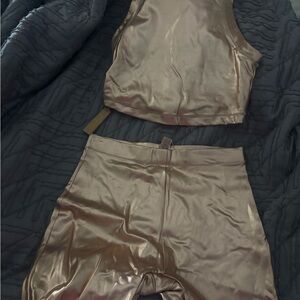 SKIMS Metallic Bronze Swim Crop Top and biker shorts